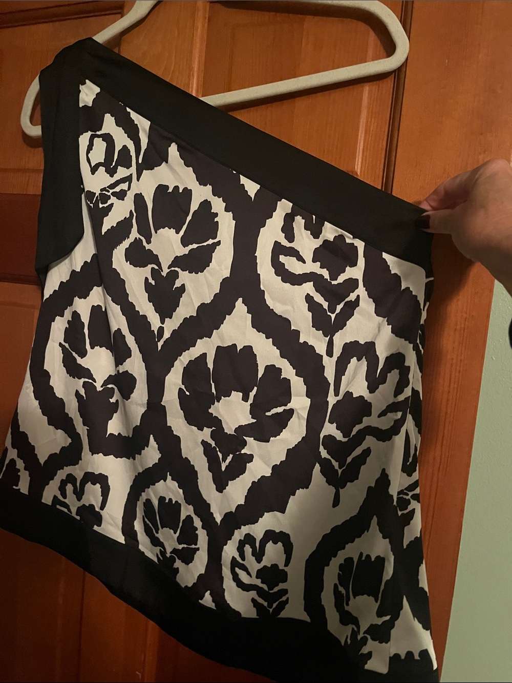 White House Black Market Black and White Ikat-Style one shoulder top. Bow detail